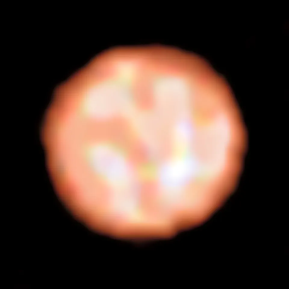 A mottled orange disc with a handful of large bright and dark patches.
