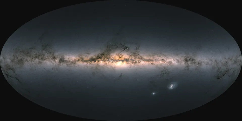 An oval map of the whole sky: a bright band of the Milky Way runs across the middle, crossed by dark dust lanes and brightest at the centre, with the two Magellanic Clouds as small smudges below right.