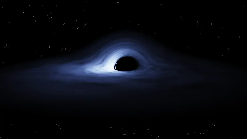 A black shadow sitting off-centre in a blue-white disk of gas, the disk brightest on the left, a few stretched stars on black around it.