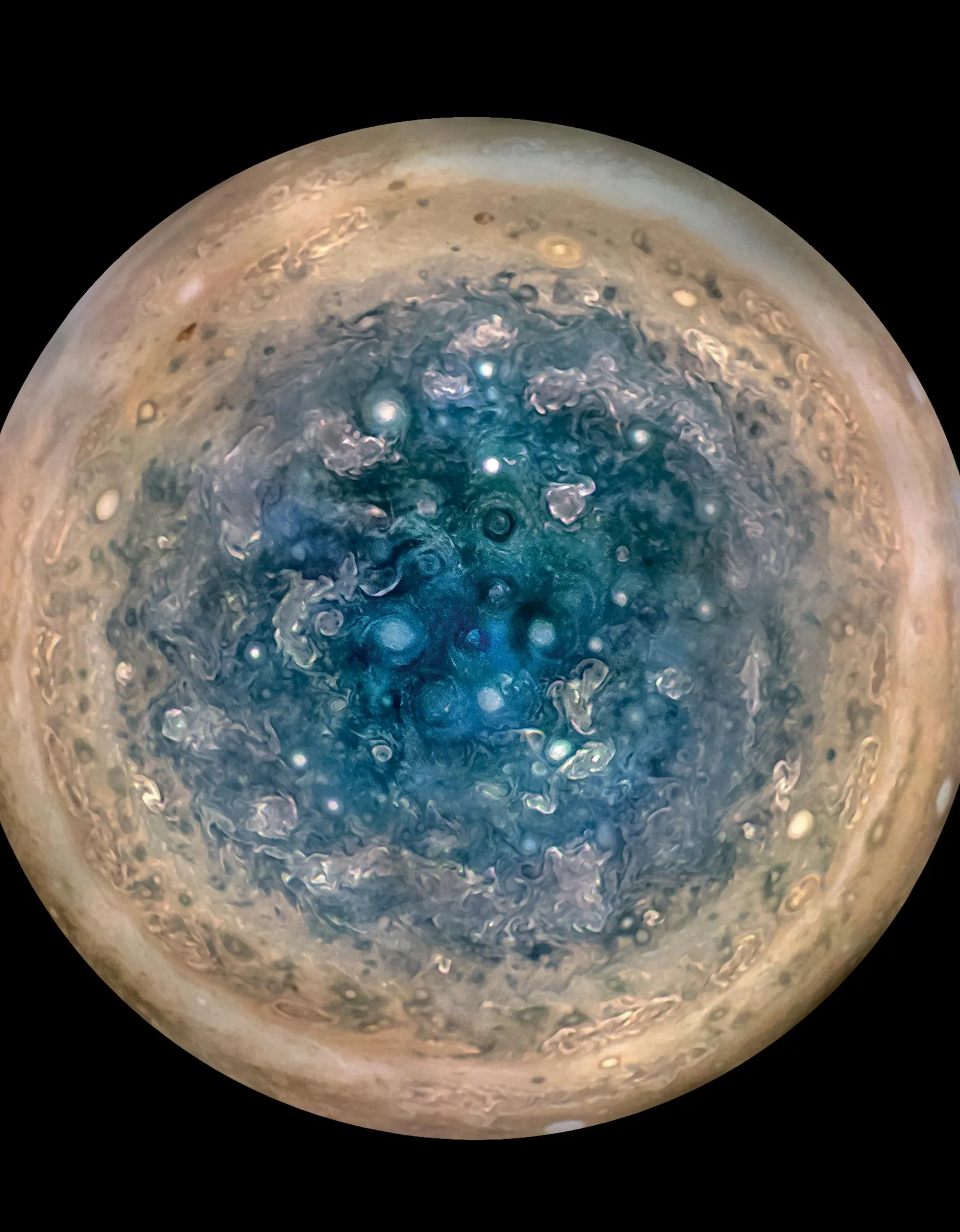 Jupiter's south pole from above, crowded with oval cyclones and swirling cloud bands