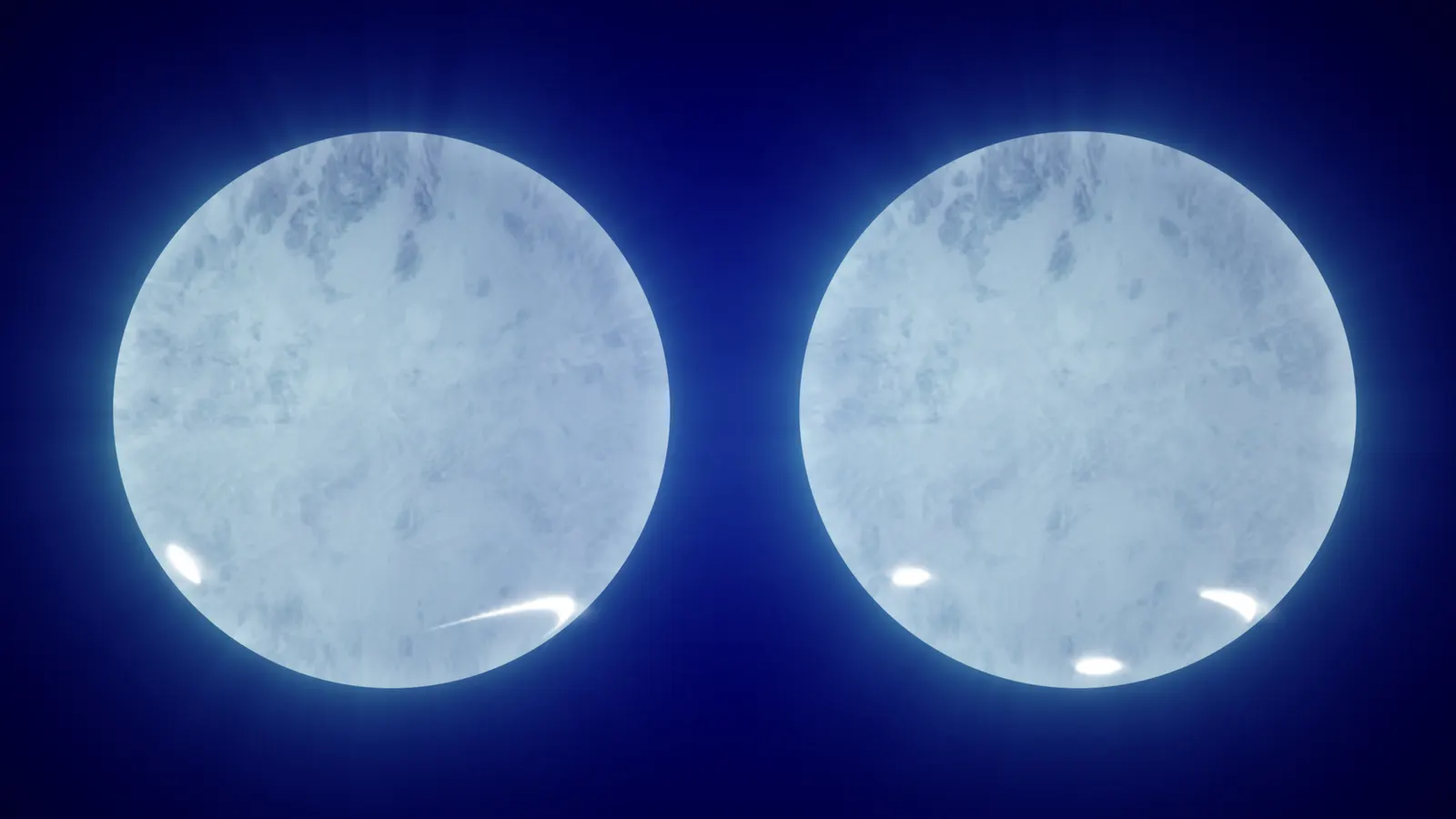Two pale blue spheres side by side; the left has a small bright circle and a bright crescent near its lower edge, the right has three small bright ovals near its lower edge.