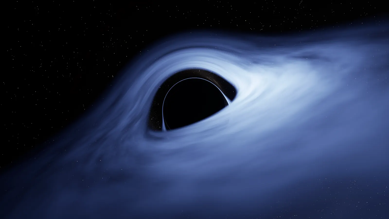 A black circle ringed by a thin bright line, surrounded by a swirling blue-white disk of gas seen at a low angle, with stars scattered across the black sky behind.
