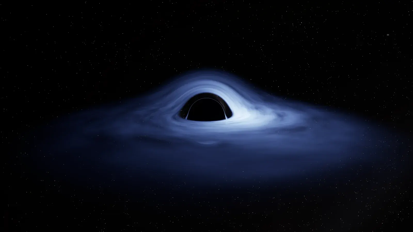 A black shadow ringed by a thin bright line, set in a wide blue-white disk of gas whose far side arches over the top of the shadow, against a black starry sky.