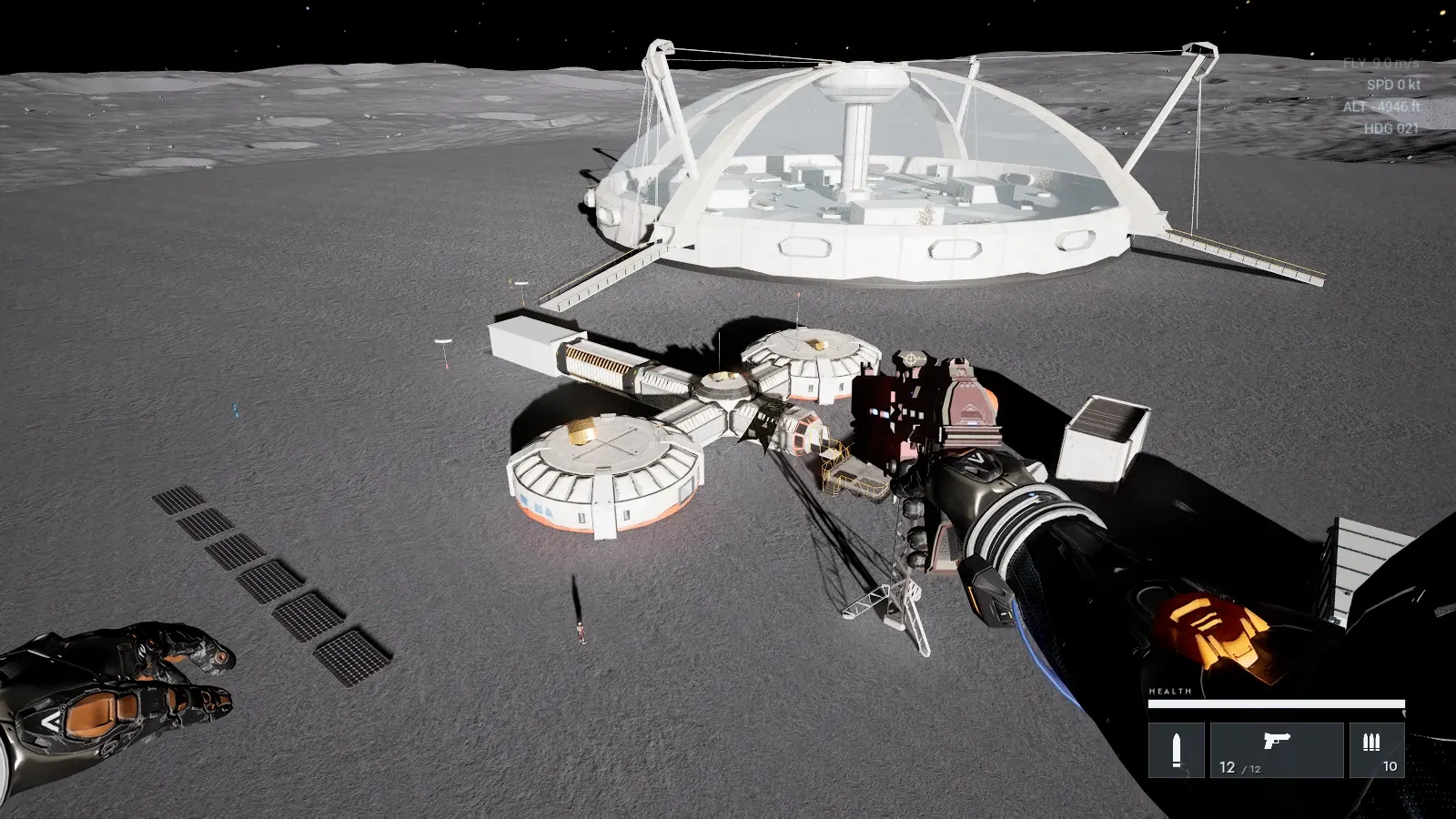 A glazed dome and white round modules on a grey lunar plain, seen from above, with solar panels beside them.