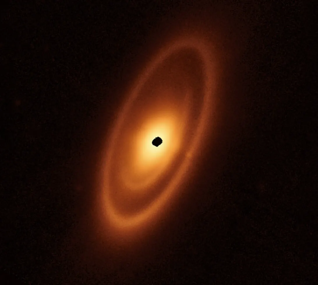 Infrared image of a star surrounded by a bright inner disc, a darker gap, an intermediate belt, a second gap and a broad outer ring