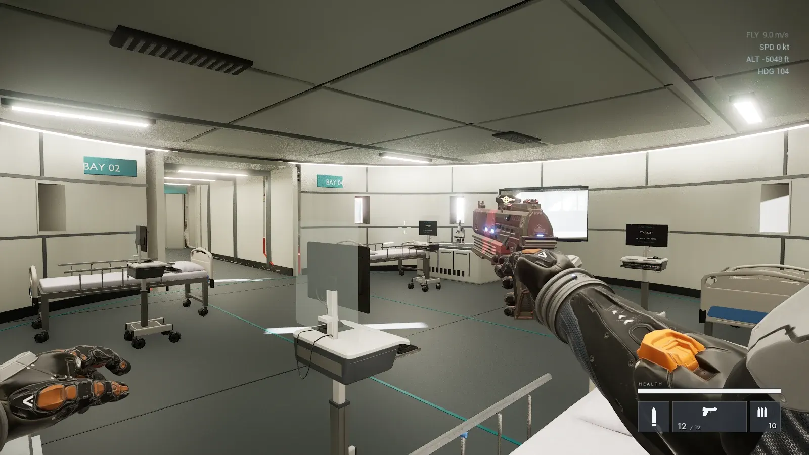 A bright medical bay with beds, monitors and a wall screen, a bay sign reading BAY 02.