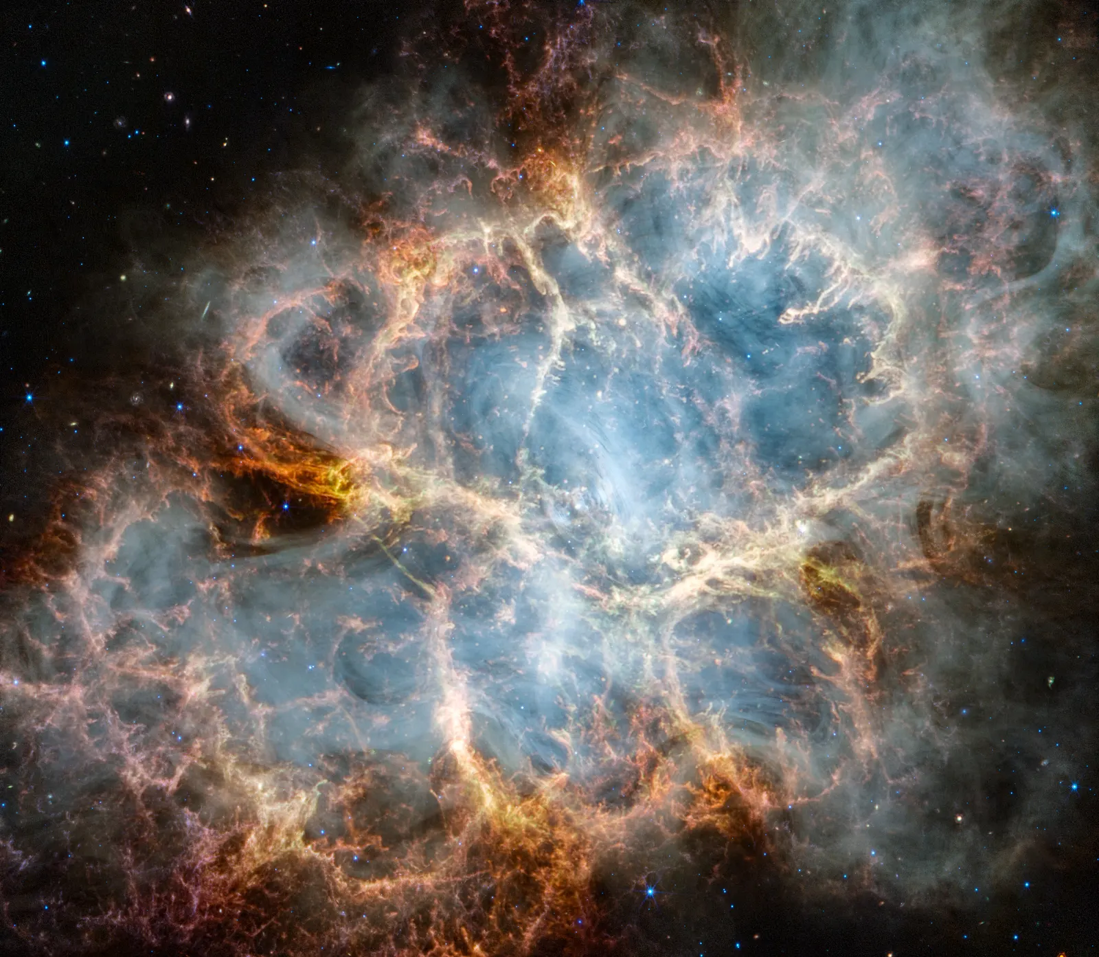 A cage-like cloud of orange and red filaments around a pale, smoky interior against a dark sky.